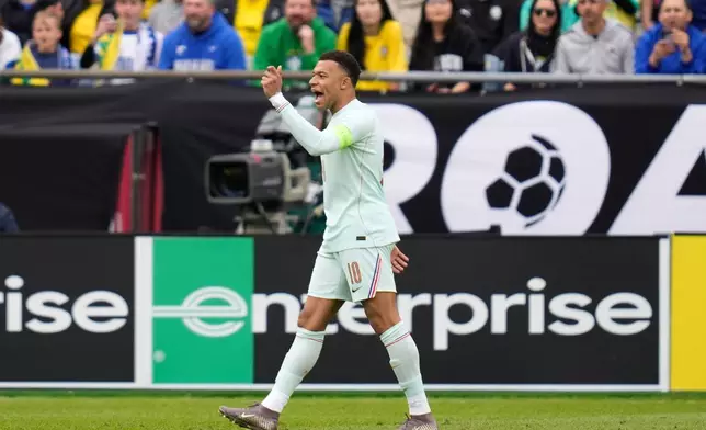 Kylian Mbappe of France gestures during the international friendly soccer match between Brazil and France in Foxborough, Mass, Thursday, March 26, 2026. (AP Photo/Charles Krupa)