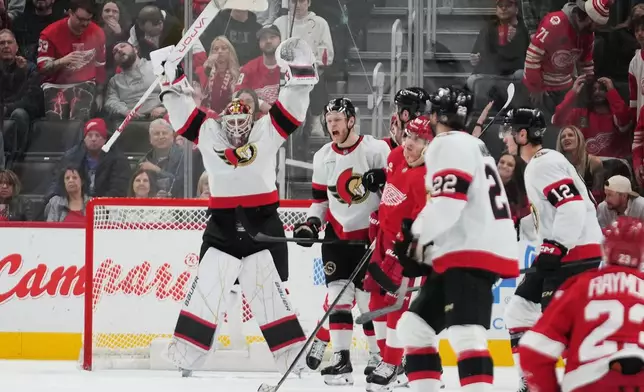 Ottawa Senators goaltender Linus Ullmark (35) celebrates after beating the Detroit Red Wings in an NHL hockey game Tuesday, March 24, 2026, in Detroit. (AP Photo/Paul Sancya)