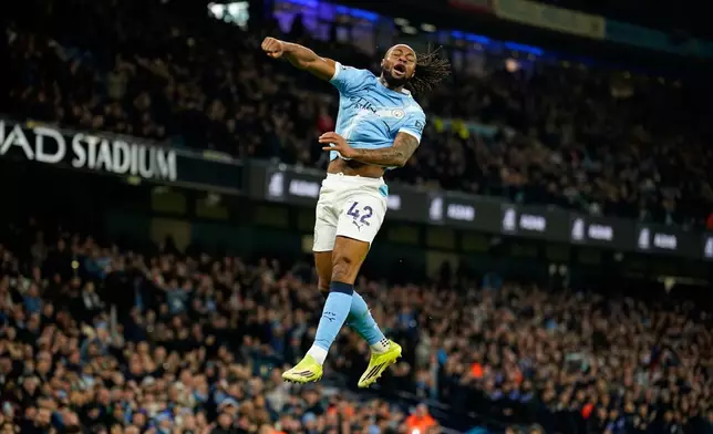 Manchester City's Antoine Semenyo celebrates after scoring the opening goal during the English Premier League soccer match between Manchester City and Nottingham Forest in Manchester, England, Wednesday, March 4, 2026. (AP Photo/Dave Thompson)