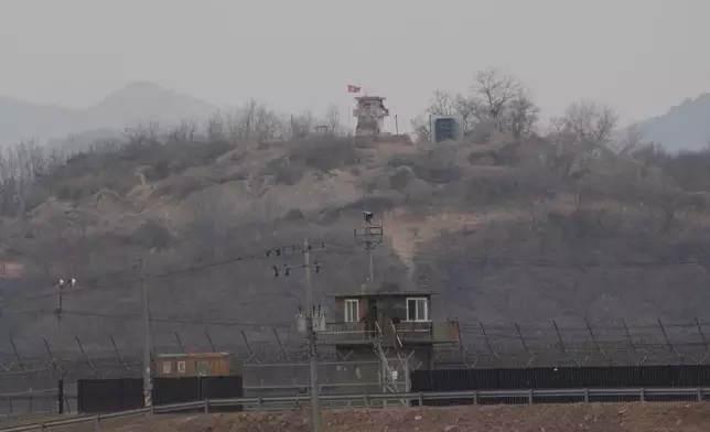 A North Korean military guard post, top, and a South Korean post, bottom, are seen from Paju, South Korea, near the border with North Korea, Thursday, Feb. 26, 2026. (AP Photo/Ahn Young-joon)