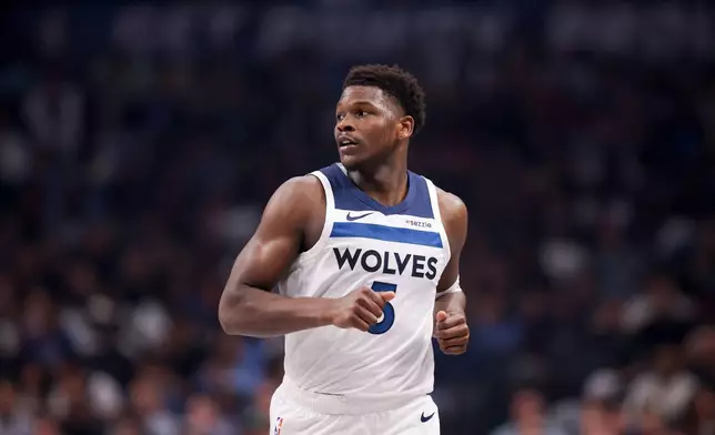 Minnesota Timberwolves guard Anthony Edwards runs the court before an NBA basketball game against the Dallas Mavericks, Monday, March 30, 2026, in Dallas. (AP Photo/Gareth Patterson)