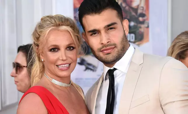 FILE - Britney Spears and Sam Asghari appear at the Los Angeles premiere of "Once Upon a Time in Hollywood," on July 22, 2019. (Photo by Jordan Strauss/Invision/AP, File)