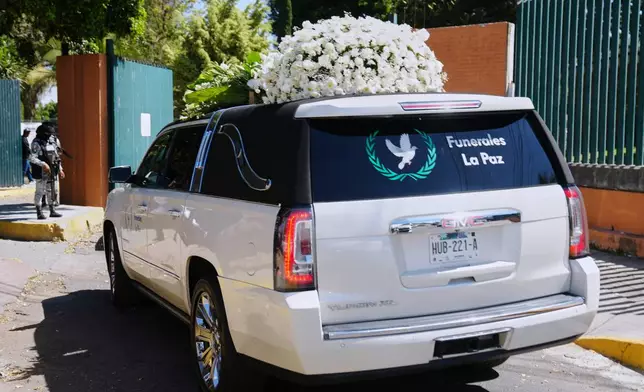 A car carrying the remains of who authorities identified as the late Jalisco New Generation Cartel leader Nemesio Oseguera, alias "El Mencho," arrives at Recinto de Paz cemetery in Guadalajara, Mexico, Monday, March 2, 2026. (AP Photo/Refugio Ruiz)