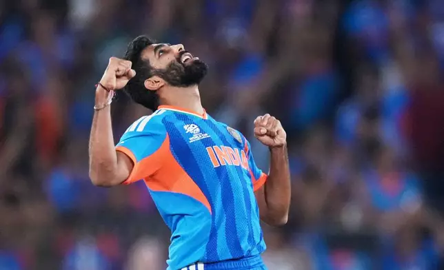 India's Jasprit Bumrah celebrates the wicket of New Zealand's Matt Henry during the T20 World Cup cricket final match between India and New Zealand in Ahmedabad, India, Sunday, March 8, 2026. (AP Photo/Ajit Solanki)