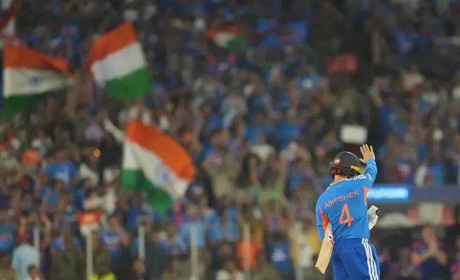 India's Abhishek Sharma celebrates his fifty runs with during the T20 World Cup cricket final match between India and New Zealand in Ahmedabad, India, Sunday, March 8, 2026. (AP Photo/Rafiq Maqbool)