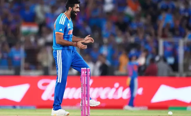 India's Jasprit Bumrah celebrates the wicket of New Zealand's James Neesham during the T20 World Cup cricket final match between India and New Zealand in Ahmedabad, India, Sunday, March 8, 2026. (AP Photo/Ajit Solanki)