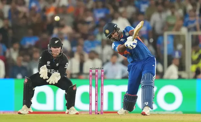 India's Sanju Samson hits a boundary during the T20 World Cup cricket final match between India and New Zealand in Ahmedabad, India, Sunday, March 8, 2026. (AP Photo/Rafiq Maqbool)