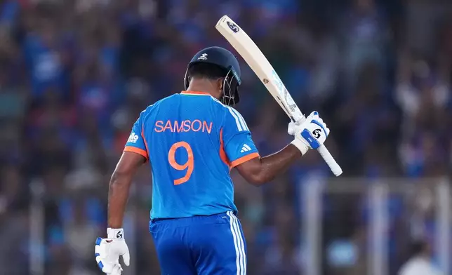 India's Sanju Samson celebrates his fifty runs during the T20 World Cup cricket final match between India and New Zealand in Ahmedabad, India, Sunday, March 8, 2026. (AP Photo/Ajit Solanki)