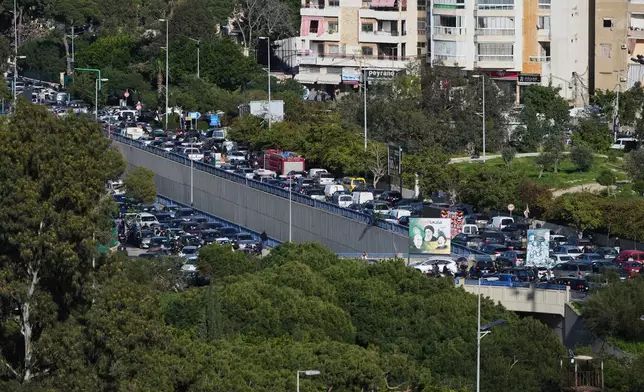 Cars sit in traffic as residents flee Israeli airstrikes in Dahiyeh, Beirut's southern suburbs, Lebanon, Thursday, March 5, 2026. (AP Photo/Hassan Ammar)