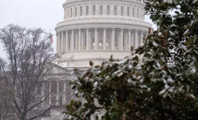 The U.S. Capitol is seen during a snowy day on Capitol Hill Thursday, March 12, 2026, in Washington. (AP Photo/Jose Luis Magana)
