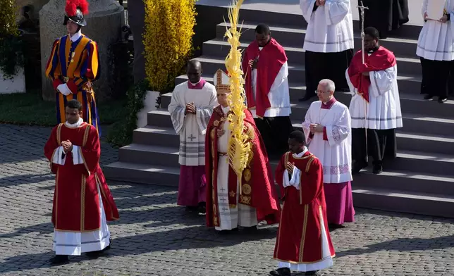 Pope Leo XIV presides over Mass in St. Peter's Square at the Vatican on the Catholic feast of Palm Sunday, commemorating Jesus' arrival in Jerusalem, Sunday, March 29, 2026. (AP Photo/Alessandra Tarantino)