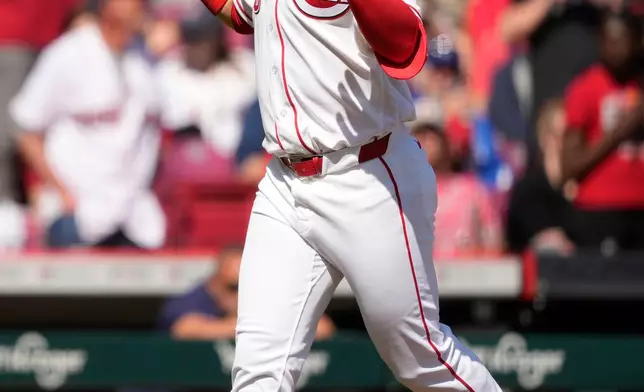 Cincinnati Reds' Eugenio Suárez celebrates as he rounds the bases after hitting a three-run homer during the sixth inning of a baseball game against the Boston Red Sox in Cincinnati, Sunday, March 29, 2026. (AP Photo/Carolyn Kaster)