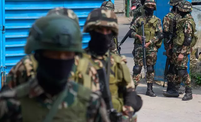 Army men patrol and as they inspect polling stations a day ahead of parliamentary election in Kathmandu, Nepal, Wednesday, March 4, 2026. (AP Photo/Niranjan Shrestha)
