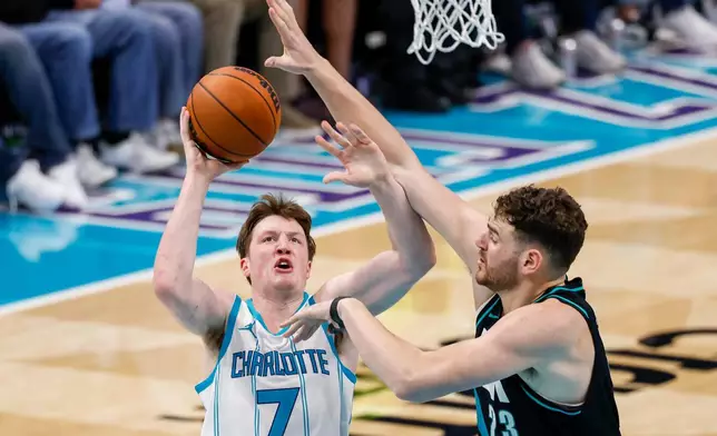 Charlotte Hornets guard Kon Knueppel (7) shoots against Portland Trail Blazers center Donovan Clingan during the second half of an NBA basketball game in Charlotte, N.C., Saturday, Feb. 28, 2026. (AP Photo/Nell Redmond)