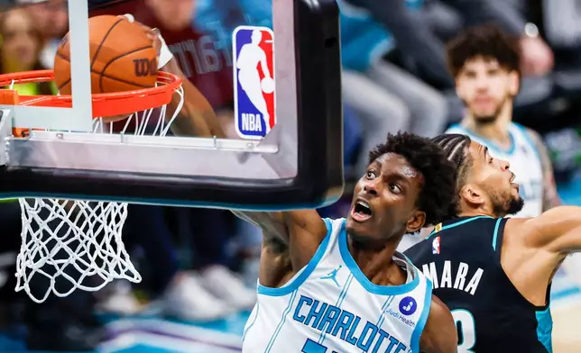 Charlotte Hornets forward Moussa Diabate dunks past the Portland Trail Blazers during the second half of an NBA basketball game in Charlotte, N.C., Saturday, Feb. 28, 2026. (AP Photo/Nell Redmond)
