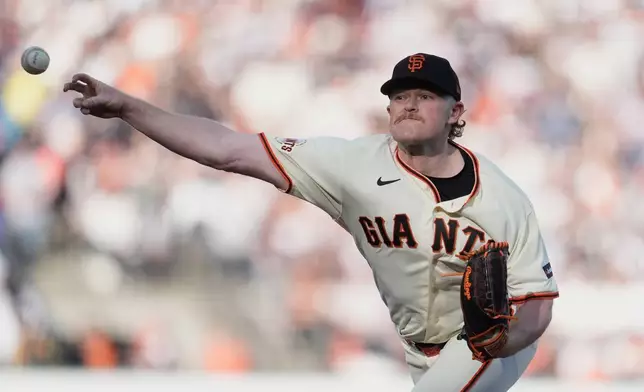 San Francisco Giants pitcher Logan Webb works against the New York Yankees during the first inning of a baseball game in San Francisco, Wednesday, March 25, 2026. (AP Photo/Jeff Chiu)