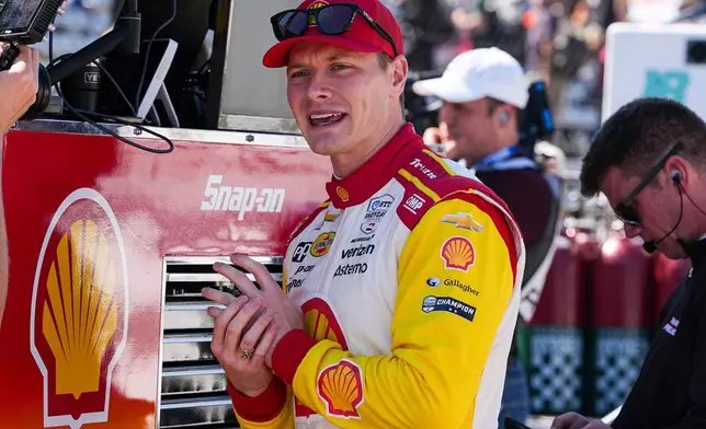 FILE - Josef Newgarden waits for the start practice for the Indianapolis 500 auto race at Indianapolis Motor Speedway in Indianapolis, Friday, May 23, 2025. (AP Photo/Michael Conroy, File)