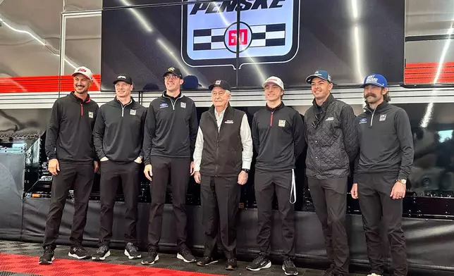 Team Penske pose for a photo as they celebrate its 60th season in motorsports on Friday, March 6, 2026 at Phoenix Raceway in Avondale, Arizona. L-R, Joey Logano, Josef Newgarden, Austin Cindric, Roger Penske, David Malukas, Scott McLauglin and Ryan Blaney. (AP Photo Jenna Fryer)