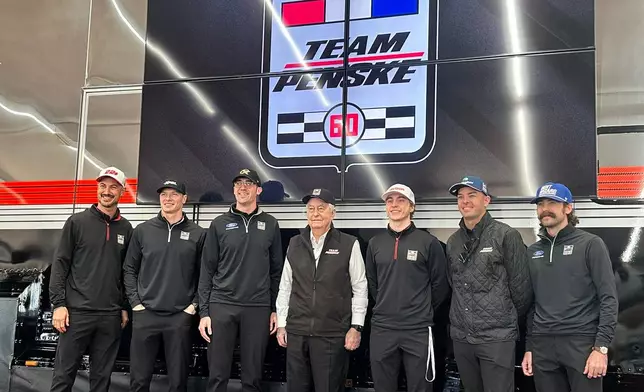 Team Penske pose for a photo as they celebrate its 60th season in motorsports on Friday, March 6, 2026 at Phoenix Raceway in Avondale, Arizona. L-R, Joey Logano, Josef Newgarden, Austin Cindric, Roger Penske, David Malukas, Scott McLauglin and Ryan Blaney. (AP Photo Jenna Fryer)