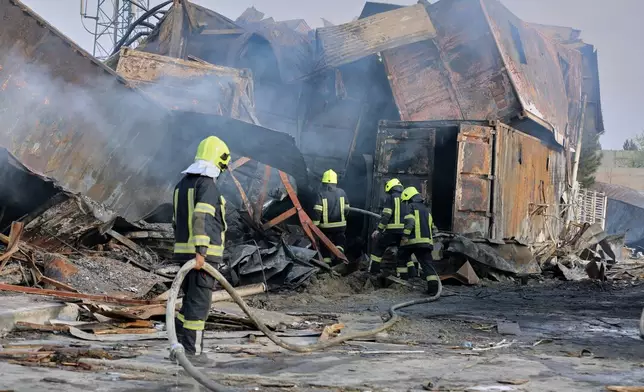 Firefighters work at the site of a late-Monday airstrike at a drug rehabilitation hospital in Kabul, Afghanistan, Tuesday, March 17, 2026. (AP Photo/Siddiqullah Alizai)