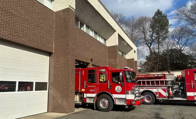 A Danbury Fire Department truck leaves the station, Sunday, Jan. 22, 2026, in Danbury, Conn. (AP Photo/Dave Collins)