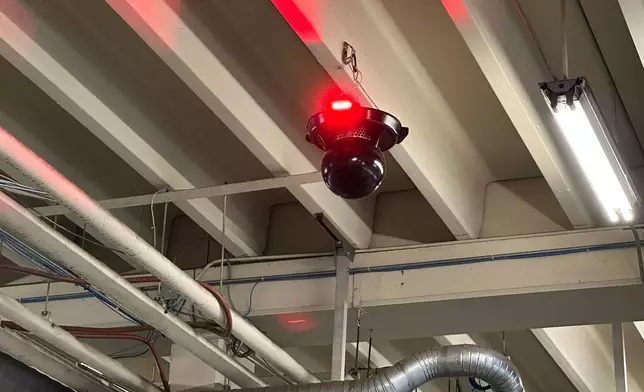 A component of Danbury’s new Phoenix G2 alerting system flashes a red light during an alarm Sunday, Jan. 22, 2026, at the Danbury Fire Department, in Danbury, Conn. (AP Photo/Dave Collins)