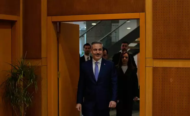 Turkey's Foreign Minister Hakan Fidan arrives prior to an interview with The Associated Press, in Ankara, Turkey, Saturday, March 14, 2026. (AP Photo/Khalil Hamra)