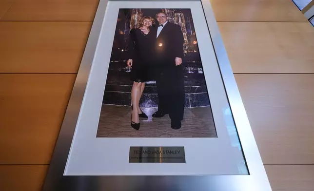 A portrait of Ted and Vada Stanley hangs in the lobby of the Broad Institute, which houses the Stanley Center for Psychiatric Research, Tuesday, March 17, 2026, in Cambridge, Mass. (AP Photo/Charles Krupa)