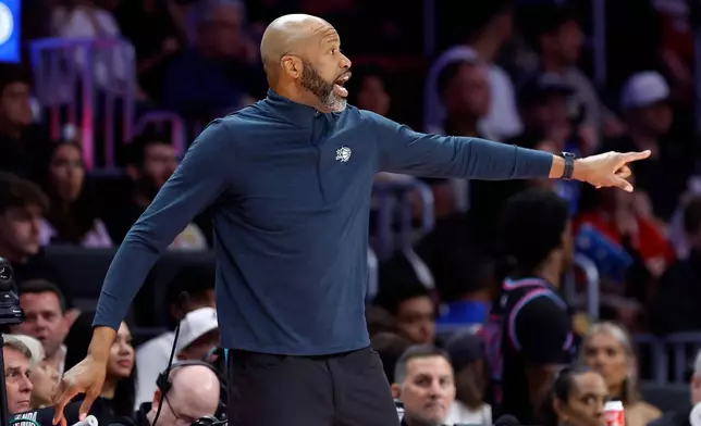 Orlando Magic head coach Jamahl Mosley reacts during the first half of an NBA basketball game against the Miami Heat in Miami, Saturday, March 14, 2026. (AP Photo/Rhona Wise)