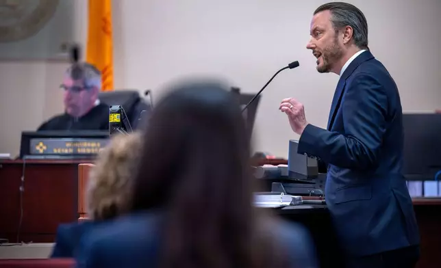 Meta attorney Kevin Huff makes closing arguments, Monday, March 23, 2026, in state court, in Santa Fe, N.M., in a trial where the social media conglomerate is accused of misleading its users about how safe its platforms are for children. (Eddie Moore/The Albuquerque Journal via AP, Pool)