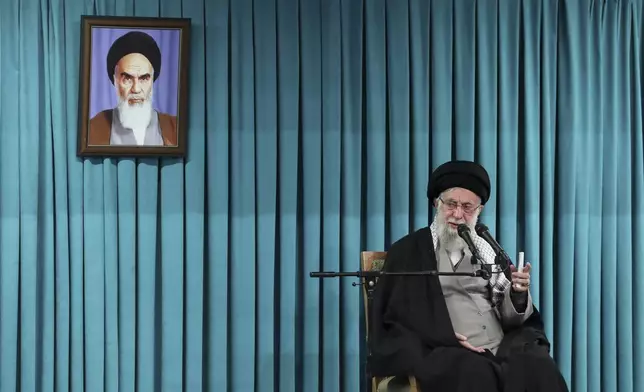 FILE - In this photo released by the official website of the office of the Iranian supreme leader, Supreme Leader Ayatollah Ali Khamenei speaks under a portrait of the late revolutionary founder Ayatollah Khomeini, in a ceremony meeting a group of officials, in Tehran, Iran, March 8, 2025. (Office of the Iranian Supreme Leader via AP, File)