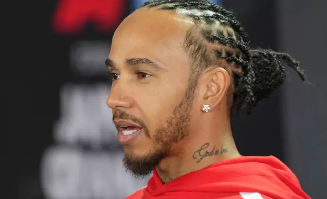 Ferrari driver Lewis Hamilton of Britain speaks with media prior to the Japanese Formula One Grand Prix Thursday, March 26, 2026, in Suzuka, central Japan. (AP Photo/Eugene Hoshiko)