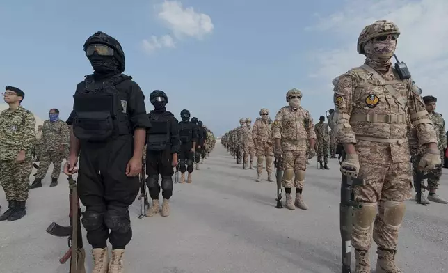 In this image provided by Sepahnews of the Iranian Revolutionary Guard on Feb. 16, 2026, shows troops standing at attention during the guard's drill in the Persian Gulf on Monday, Feb. 16, 2026. (Sepahnews via AP)