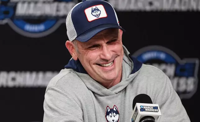 UConn head coach Dan Hurley laughs during a press conference ahead of a game against Duke in the Elite Eight of the NCAA college basketball tournament Saturday, March 28, 2026, in Washington. (AP Photo/Abbie Parr)