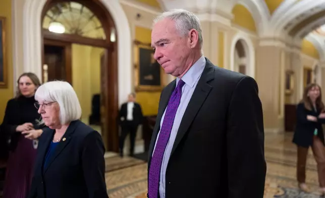Sen. Tim Kaine, D-Va., center, and Sen. Patty Murray, D-Wash., left, arrive to speak with reporters at the Capitol in Washington, Tuesday, March 3, 2026. Kaine is leading an effort to advance a swift vote on a war powers resolution that would restrain President Donald Trump's military attack on Iran. (AP Photo/J. Scott Applewhite)