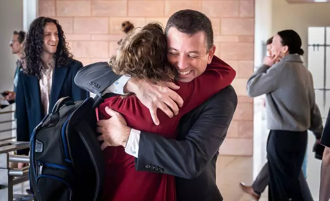 Civil litigator David Ackerman embraces New Mexico state attorney Linda Singer following a landmark verdict where the jury found Meta willfully violated New Mexico's consumer protection laws and are ordered to pay the state $375 million in damages, Tuesday, March 24, 2026 , in Santa Fe, N.M. (Nathan Burton/Santa Fe New Mexican via AP, Pool)