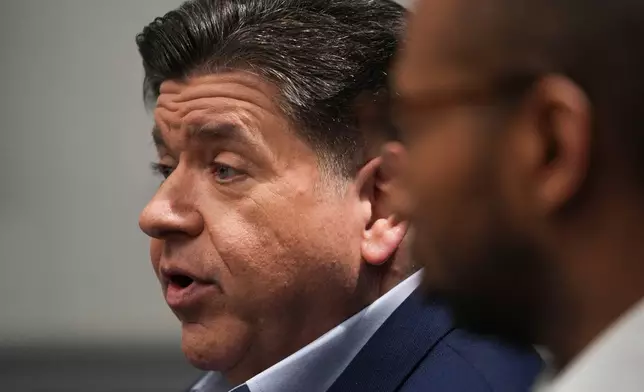 Illinois Gov. JB Pritzker with running mate, for lieutenant governor, Christian Mitchell speaks during an interview, Wednesday, March 18, 2026, in Chicago. (AP Photo/Erin Hooley)