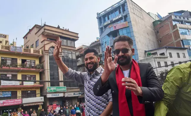 Balendra Shah, right, former mayor of Kathmandu Metropolitan City and prime ministerial candidate of the Rastriya Swatantra Party, joins Rabi Lamichhane, left, the party's president, during an election campaign rally in Lalitpur, Nepal, Saturday, Feb. 28, 2026. (AP Photo/Niranjan Shrestha, File)