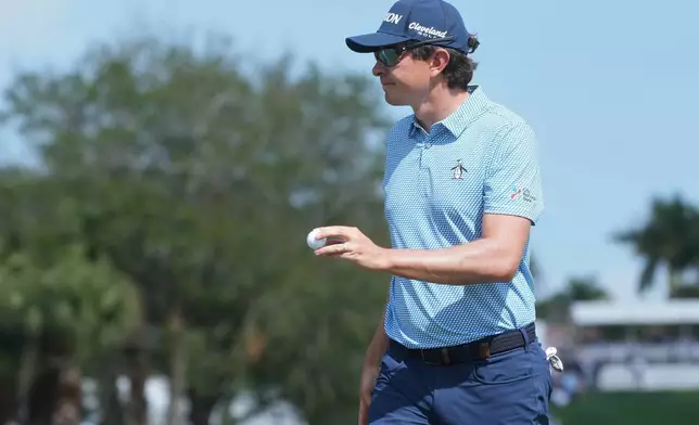 Nico Echavarria of Colombia show his ball on the first green during the final round of the Cognizant Classic golf tournament, Sunday, March 1, 2026, in Palm Beach Gardens, Fla. (AP Photo/Marta Lavandier)