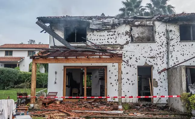 A house damaged by a drone strike in Goma, Democratic Republic of Congo, Wednesday, March 11, 2026. (AP Photo/Moses Sawasawa)