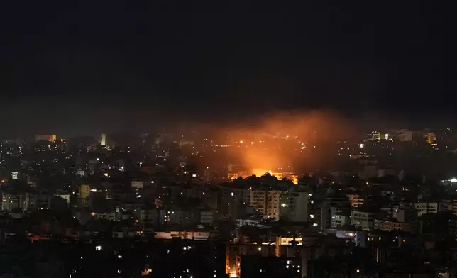 Flames rise following an Israeli airstrike in Dahiyeh, Beirut's southern suburbs, Lebanon, Friday, March 6, 2026. (AP Photo/Hassan Ammar)