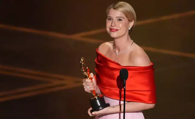 Jessie Buckley accepts the award for actress in a leading role for "Hamnet" during the Oscars on Sunday, March 15, 2026, at the Dolby Theatre in Los Angeles. (AP Photo/Chris Pizzello)