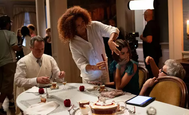 Actors Danton Mello, left, and Theresa Fonseca, second from right, prepare to film a scene of the soap opera "A Nobreza do Amor," at a TV Globo set in Rio de Janeiro, Thursday, March 12, 2026. (AP Photo/Bruna Prado)