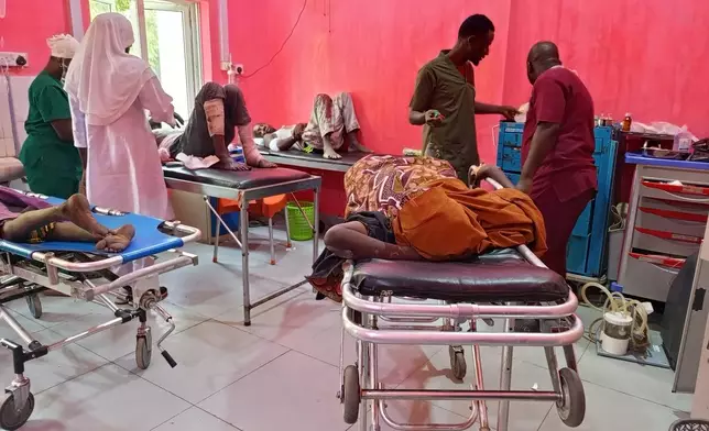 Victims of Monday's bomb blast at a market receives treatment at a hospital in Maiduguri, Nigeria, Tuesday, March 17, 2026. (AP Photo/Jossy Ola)