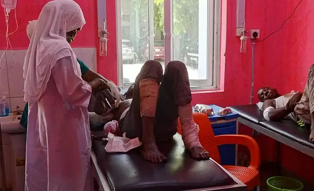 Victims of Monday's bomb blast at a market receives treatment at a hospital in Maiduguri, Nigeria, Tuesday, March 17, 2026. (AP Photo/Jossy Ola)