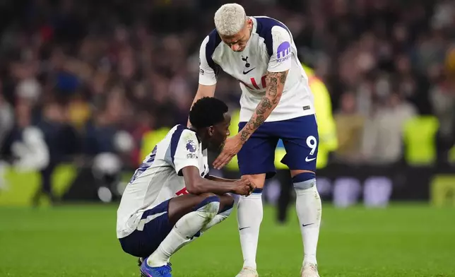 Tottenham Hotspur's Pape Matar Sarr, left, and Richarlison react after the English Premier League soccer match between Tottenham Hotspur and Crystal Palace in London, Thursday March 5, 2026. (John Walton/PA via AP)