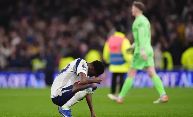 Tottenham Hotspur's Pape Matar Sarr reacts after the English Premier League soccer match between Tottenham Hotspur and Crystal Palace in London, Thursday, March 5, 2026. (John Walton/PA via AP)