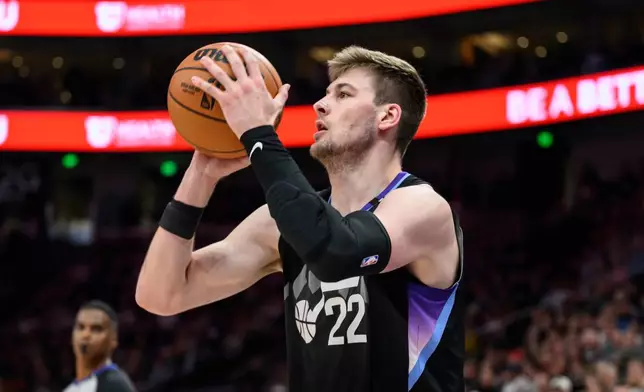 Utah Jazz forward Kyle Filipowski looks to shoot during the first half of an NBA basketball game against the Cleveland Cavaliers, Monday, March 30, 2026, in Salt Lake City. (AP Photo/Tyler Tate)