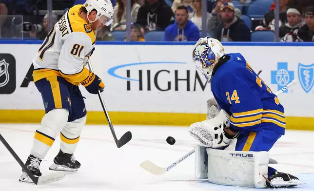 Nashville Predators center Jonathan Marchessault (81) is stopped by Buffalo Sabres goaltender Alex Lyon (34) during the second period of an NHL hockey game Saturday, March 7, 2026, in Buffalo, N.Y. (AP Photo/Jeffrey T. Barnes)