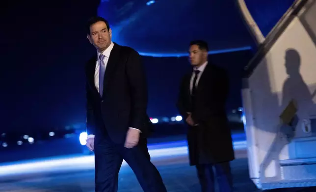 U.S. Secretary of State Marco Rubio arrives at Paris-Le Bourget Airport, in Le Bourget, France, early Friday, March 27, 2026, to take part in the G7 foreign ministers' meeting. (Brendan Smialowski/Pool Photo via AP)